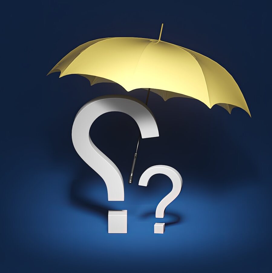 a yellow umbrella with a question mark underneath it